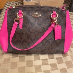 - COACH fuchsia and brown signature canvas and satchel